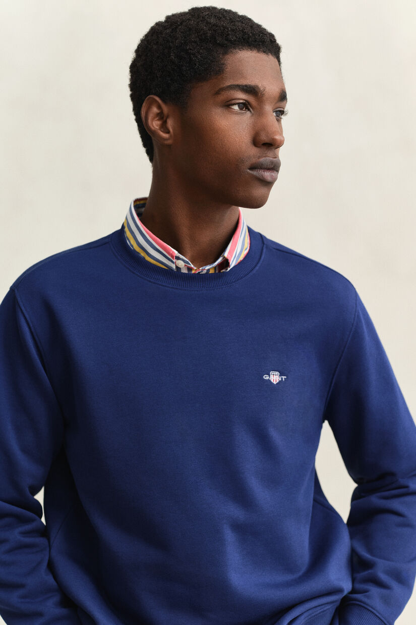 Sweat-shirt col rond avec &eacute;cusson