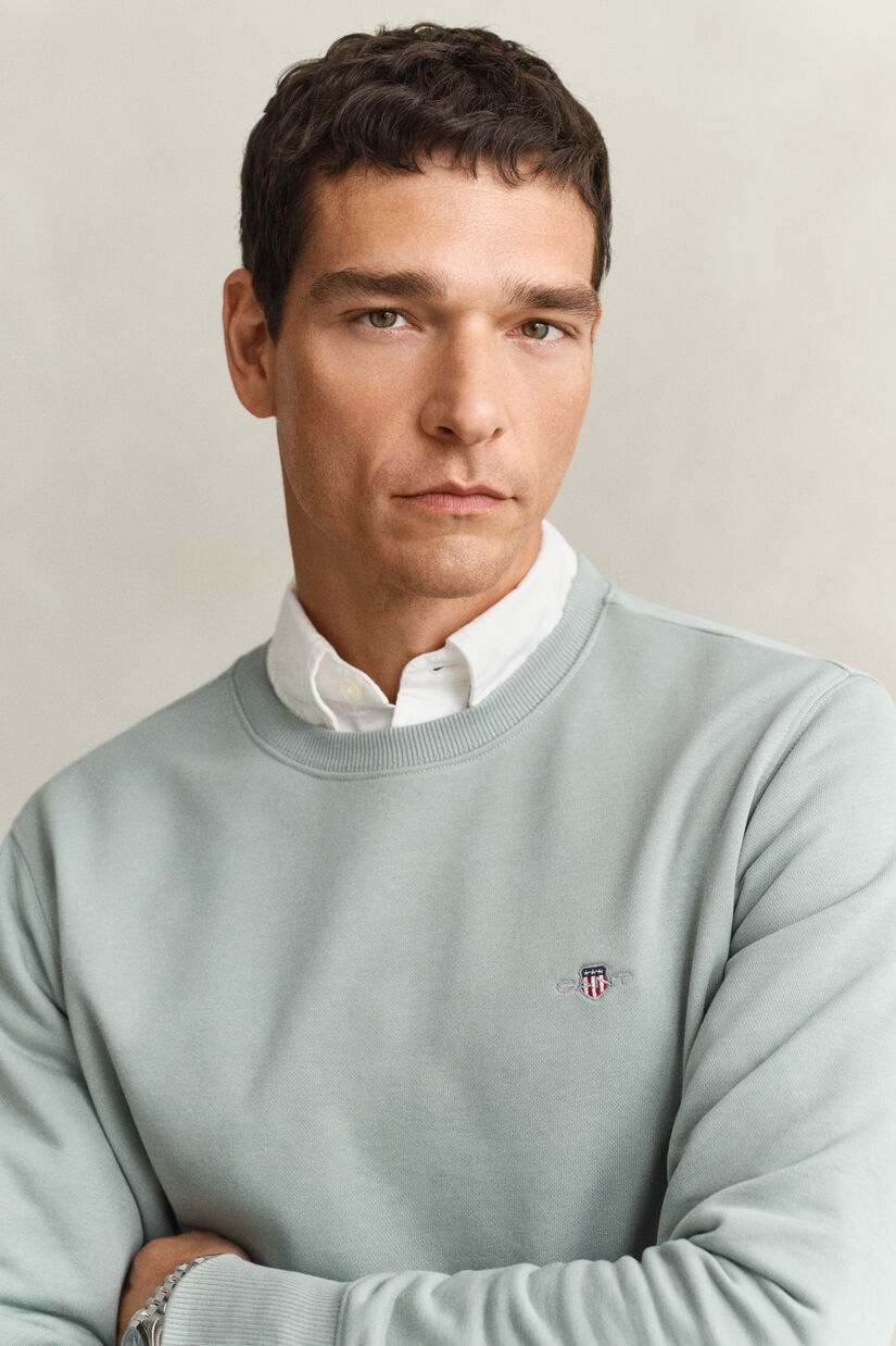 Sweat-shirt col rond avec &eacute;cusson