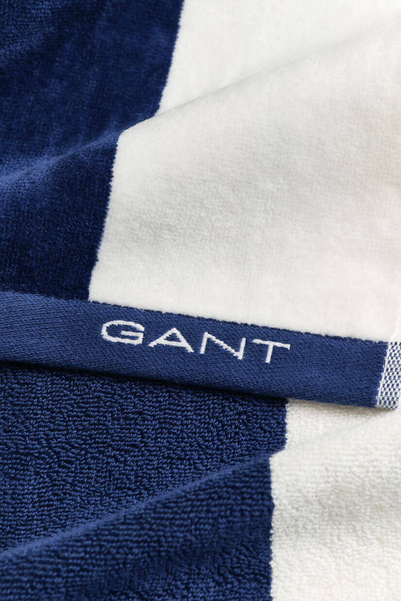 Serviette de plage &agrave; rayures &eacute;clatantes