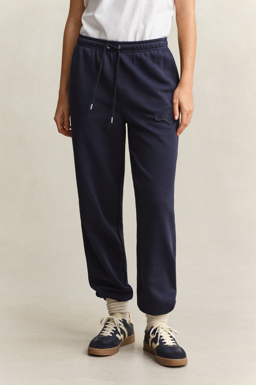 Pantalon de jogging avec &eacute;cusson ton sur ton