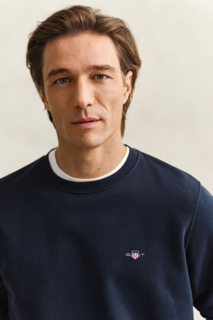 Sweat-shirt col rond avec &eacute;cusson