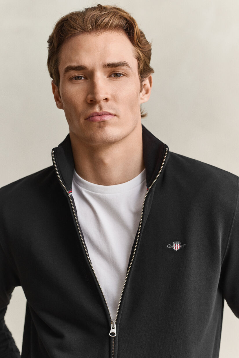 Sweat-shirt zipp&eacute; avec &eacute;cusson